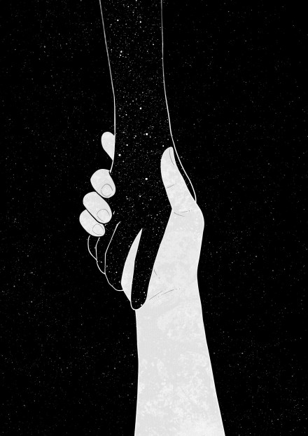 A handshake between a black hand reaching down and a white hand reaching up